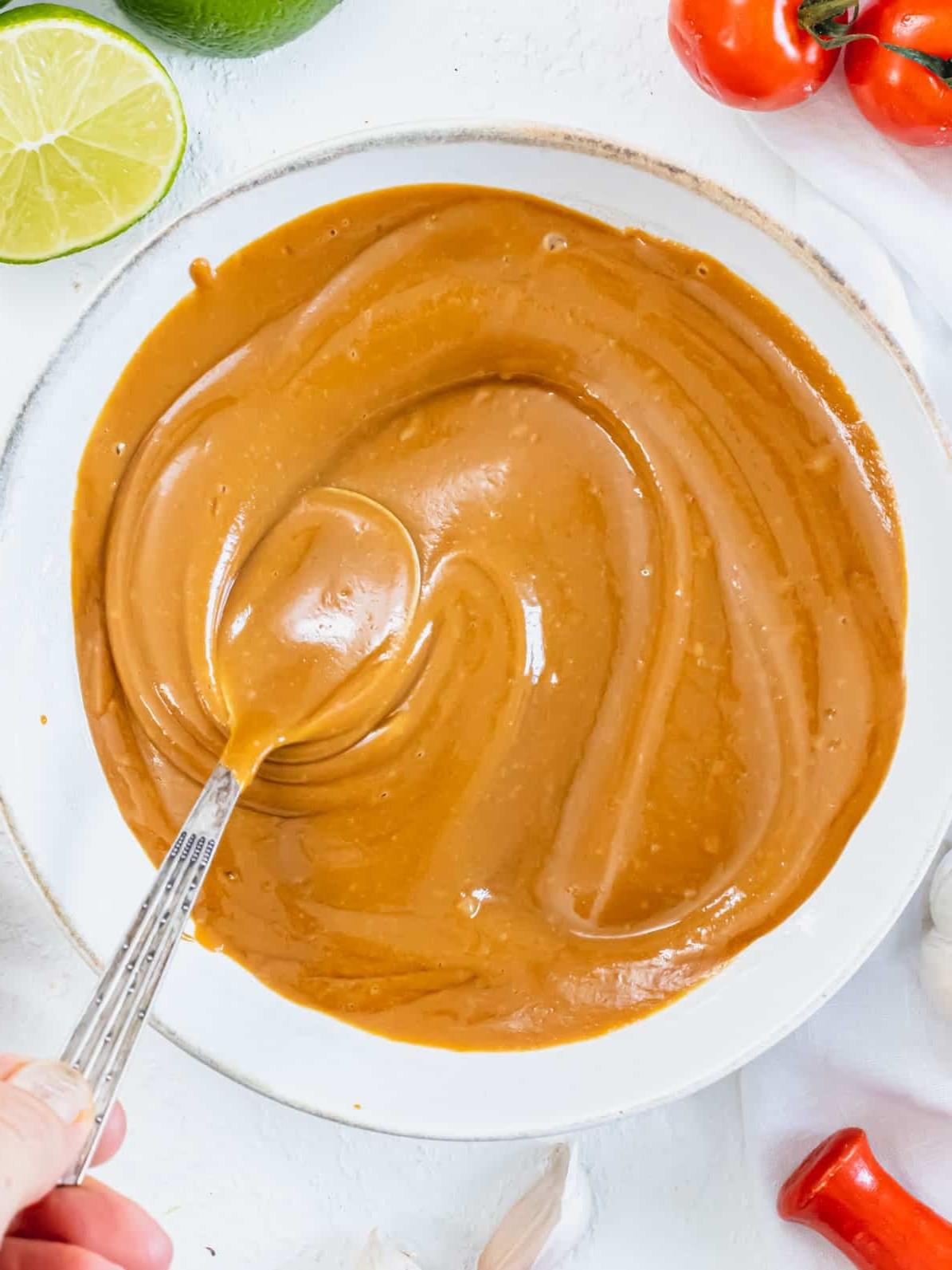 Erdnusssoßenrezept 2 creamy peanut sauce in a bowl