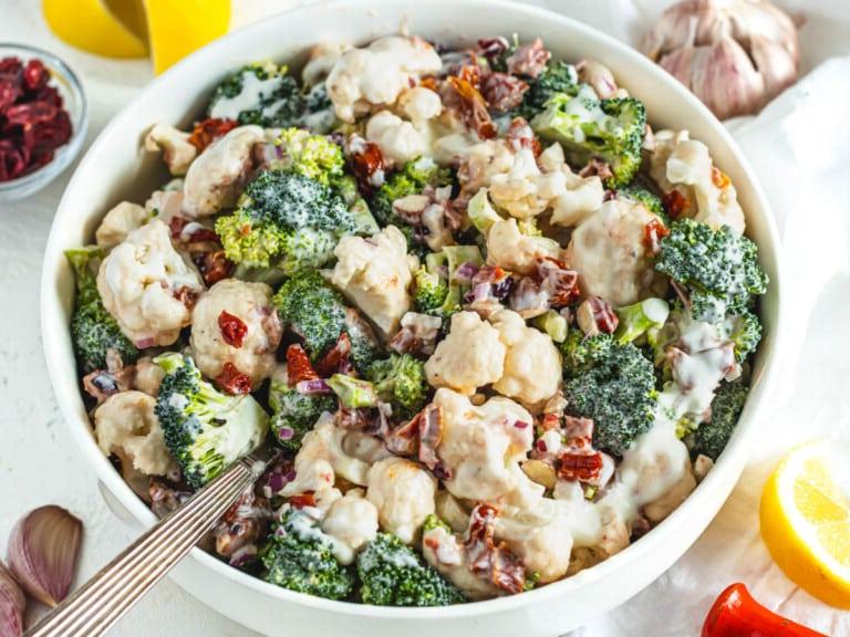 broccoli cauliflower salad with a silver spoon