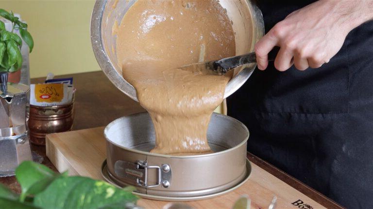 transferring the cake batter into the cake pan