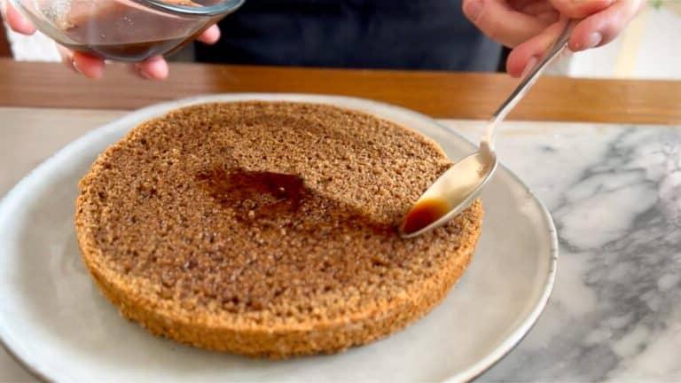 applying coffee syrup on the vegan coffee cake