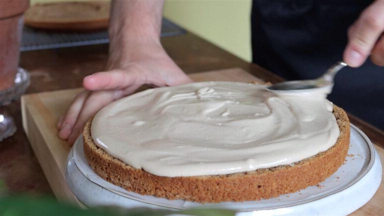 adding a layer of hazelnut cream into the cake