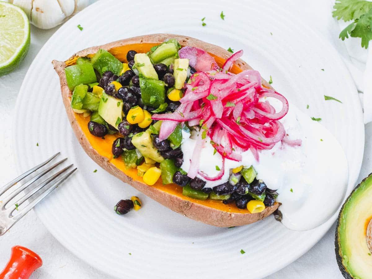Microwave stuffed sweet potato with pickled red onion and black beans
